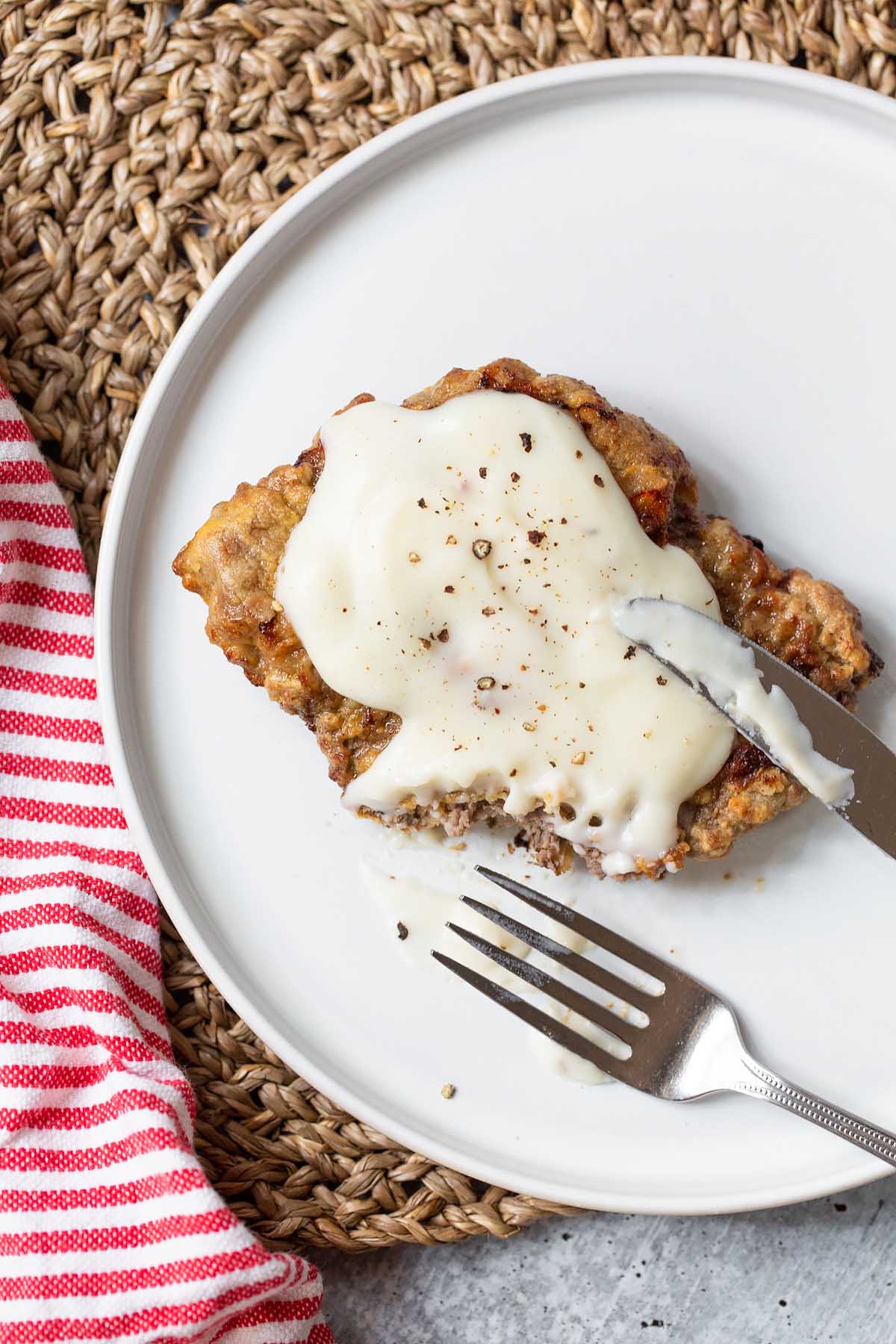 chicken fried steak with a piece cut out