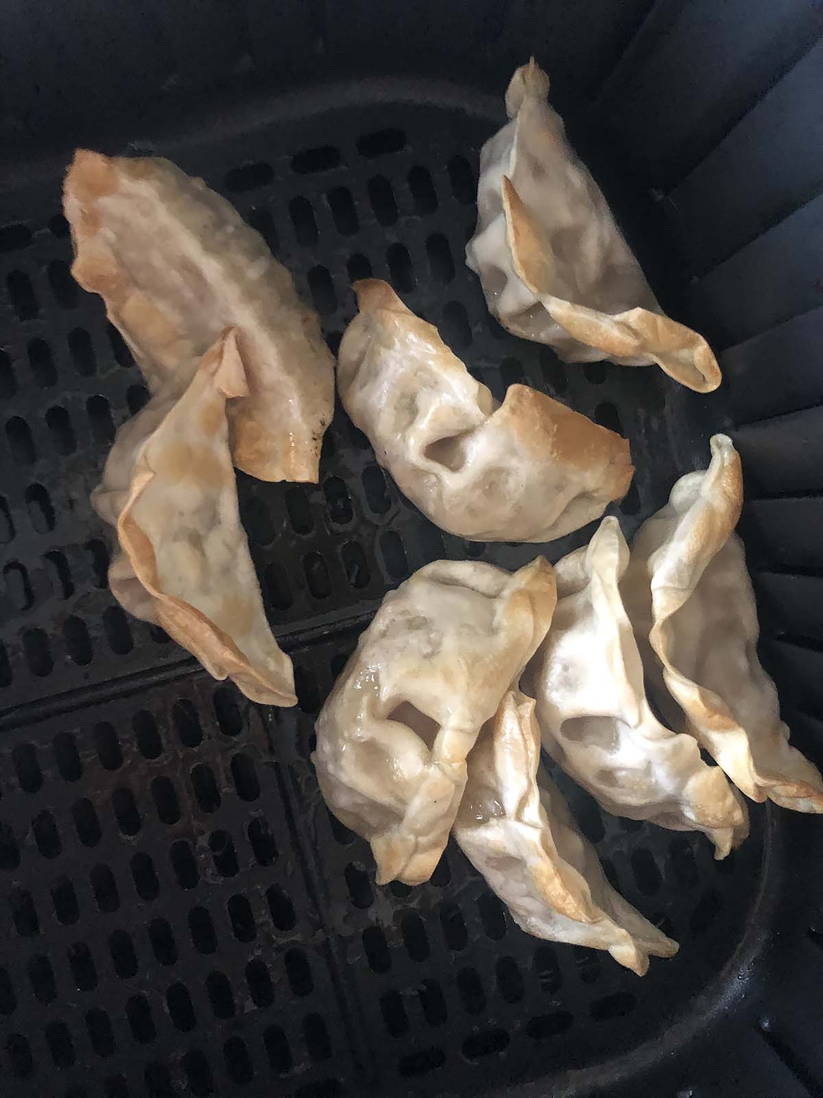 cooked potstickers in air fryer basket