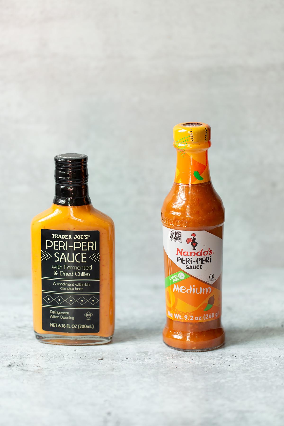 bottles of nandos and trader joes peri peri sauces