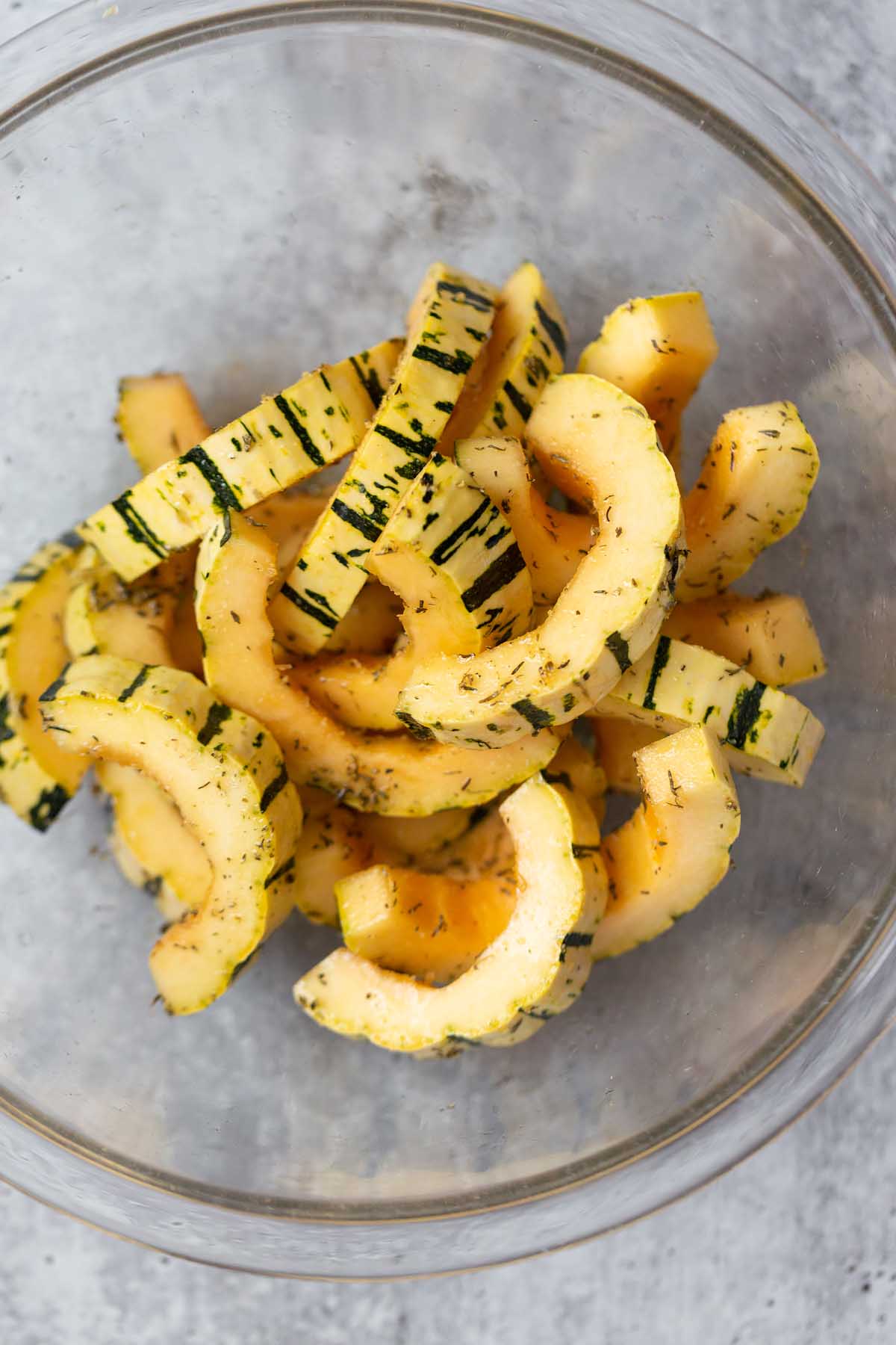 raw delicata squash in a bowl