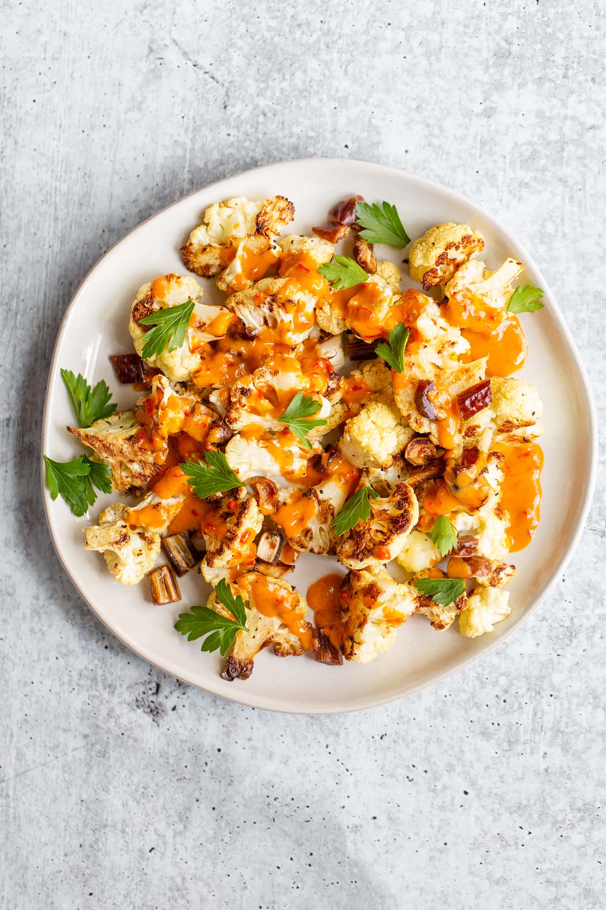 roasted cauliflower topped with harissa sauce