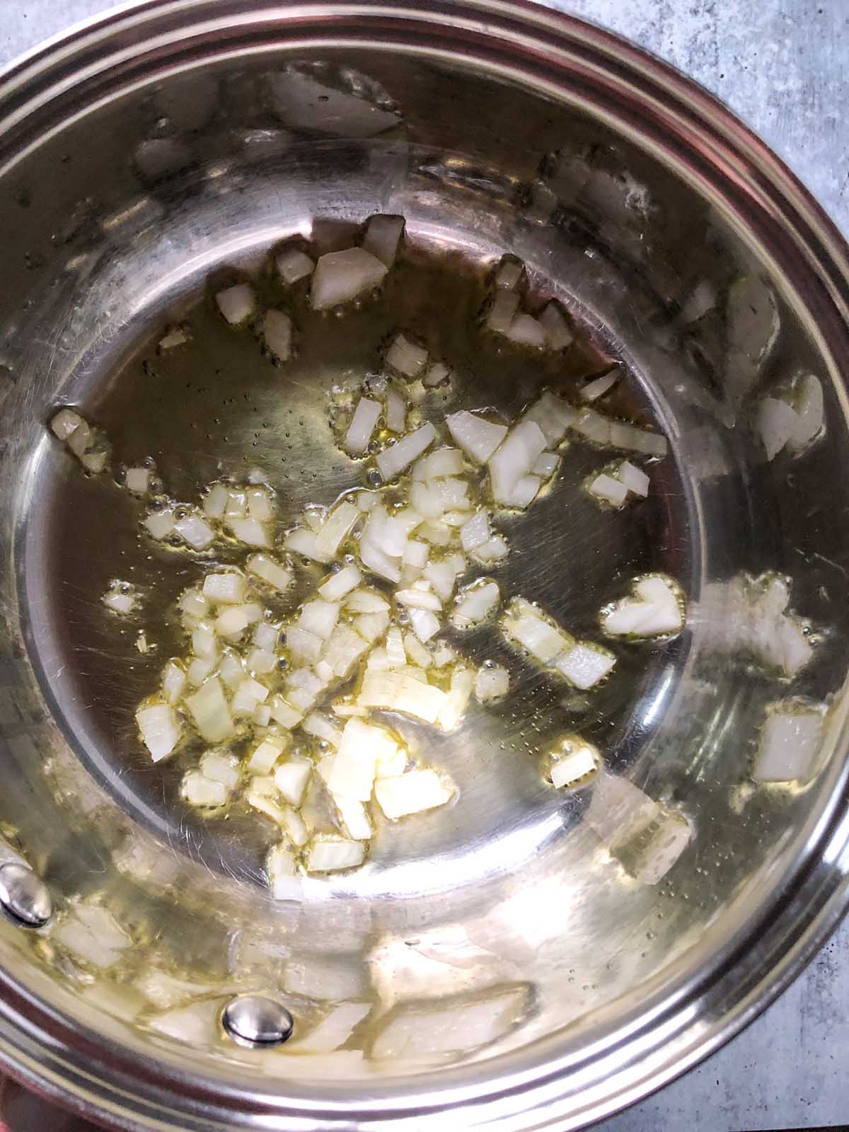 onions cooking in a pot