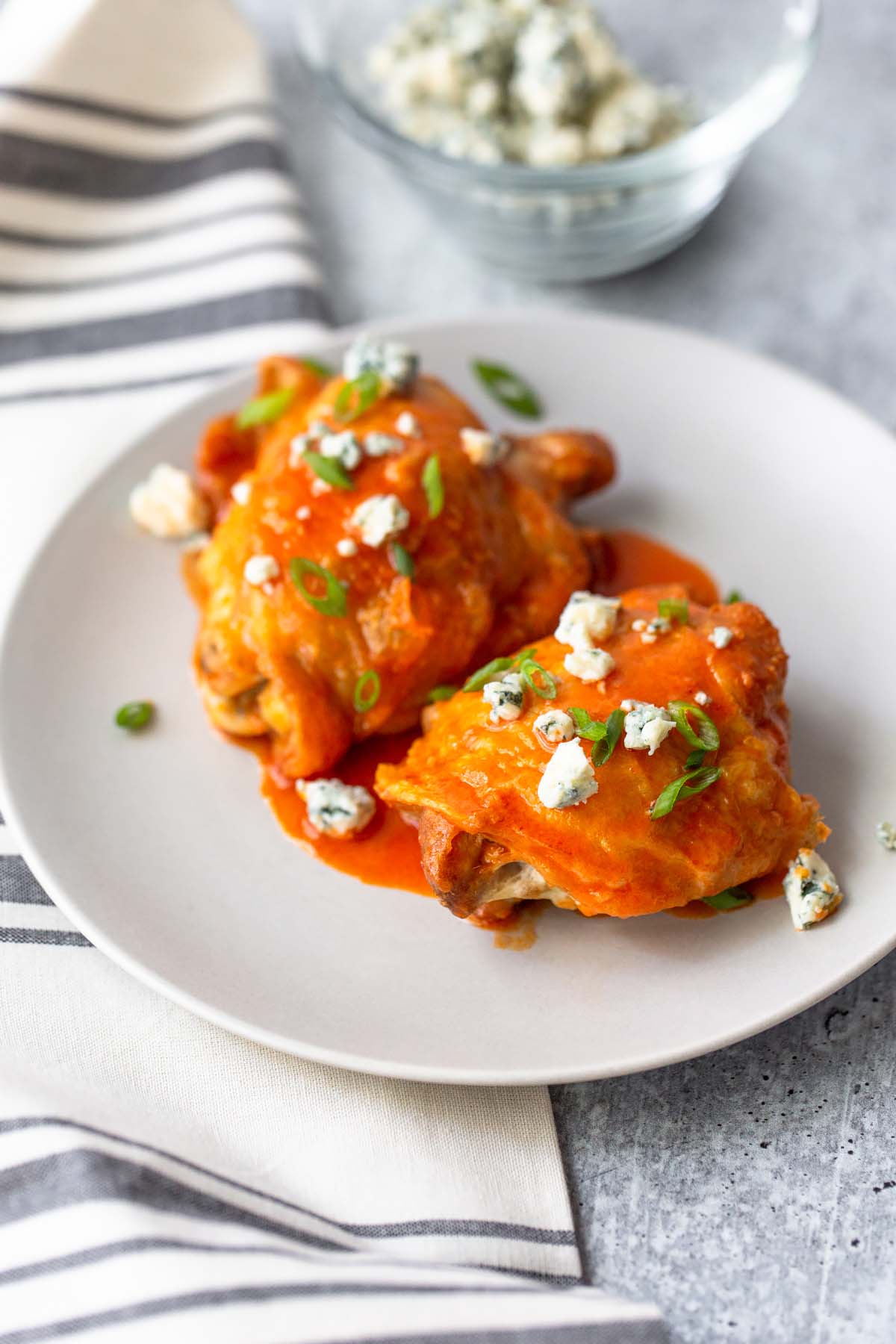 chicken thighs with buffalo sauce and blue cheese