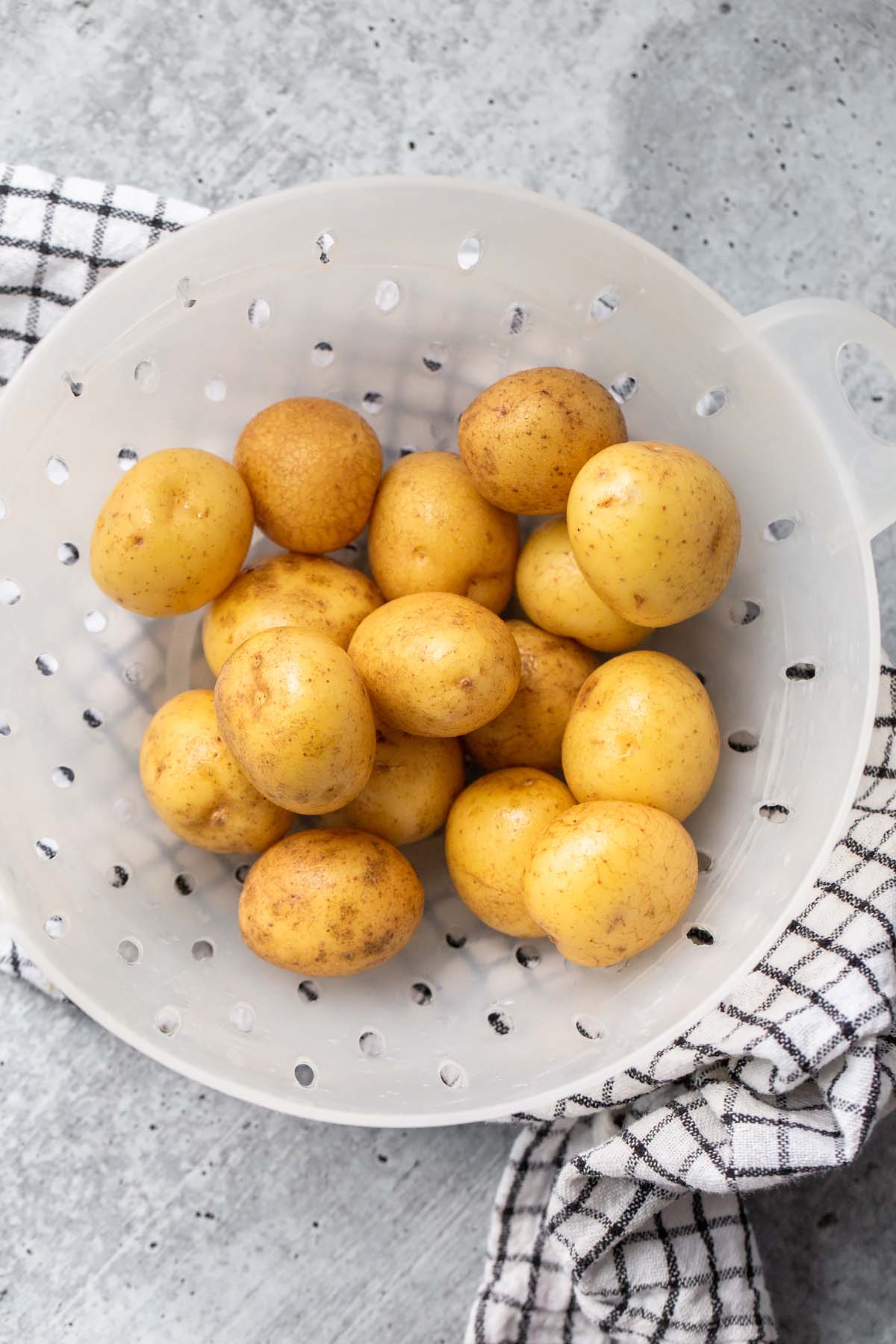raw baby potatoes in a colander