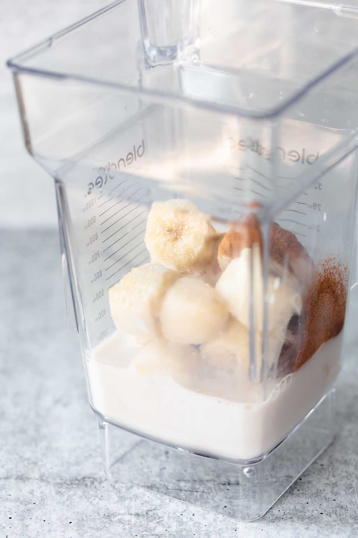 cinnamon, milk, and bananas in a blender