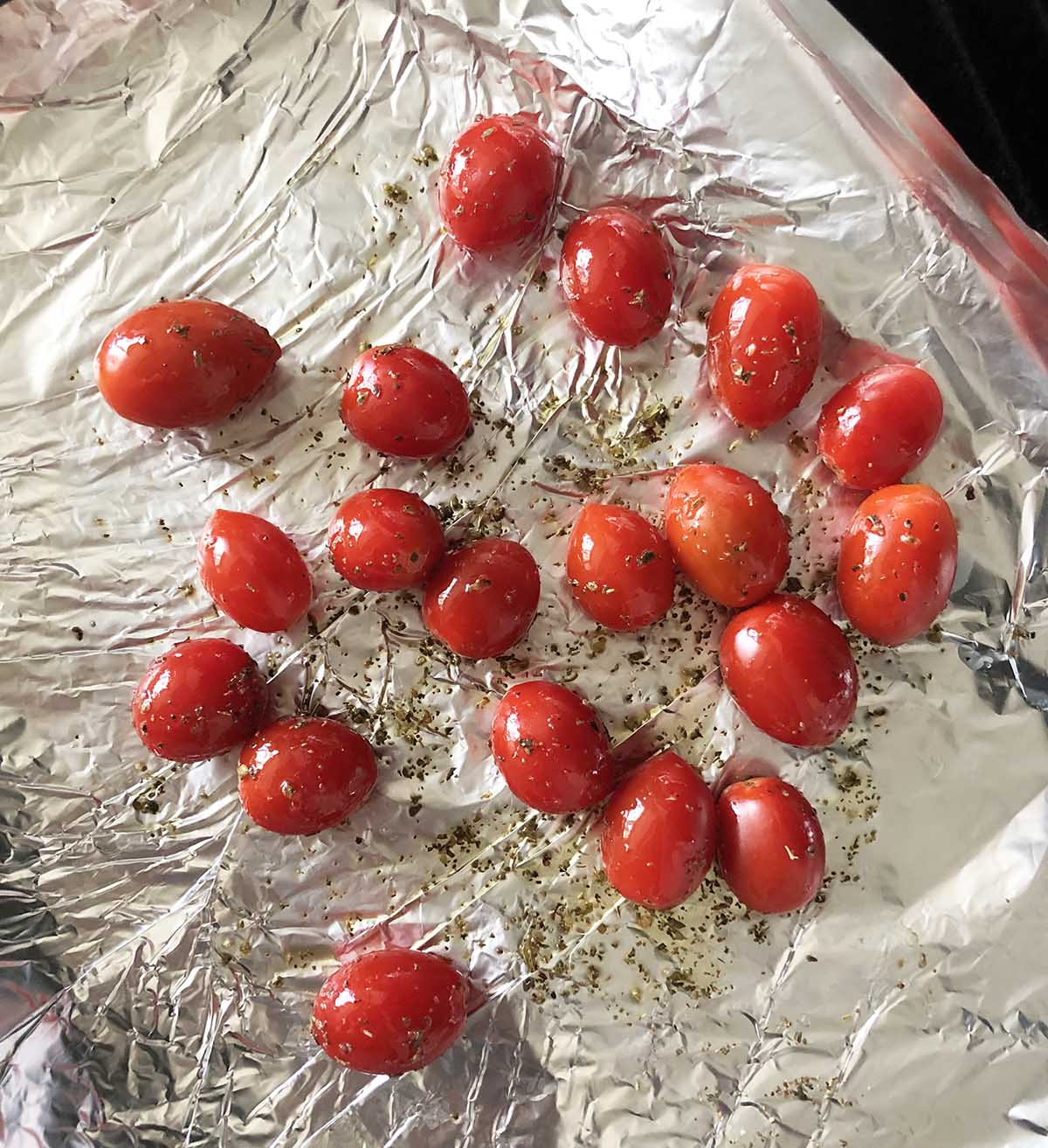 whole tomatoes on a sheet pan