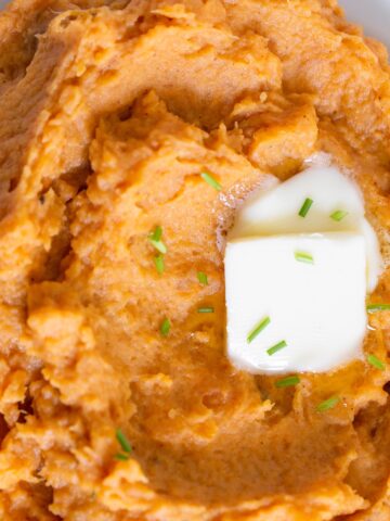 chipotle mashed sweet potatoes with butter up close