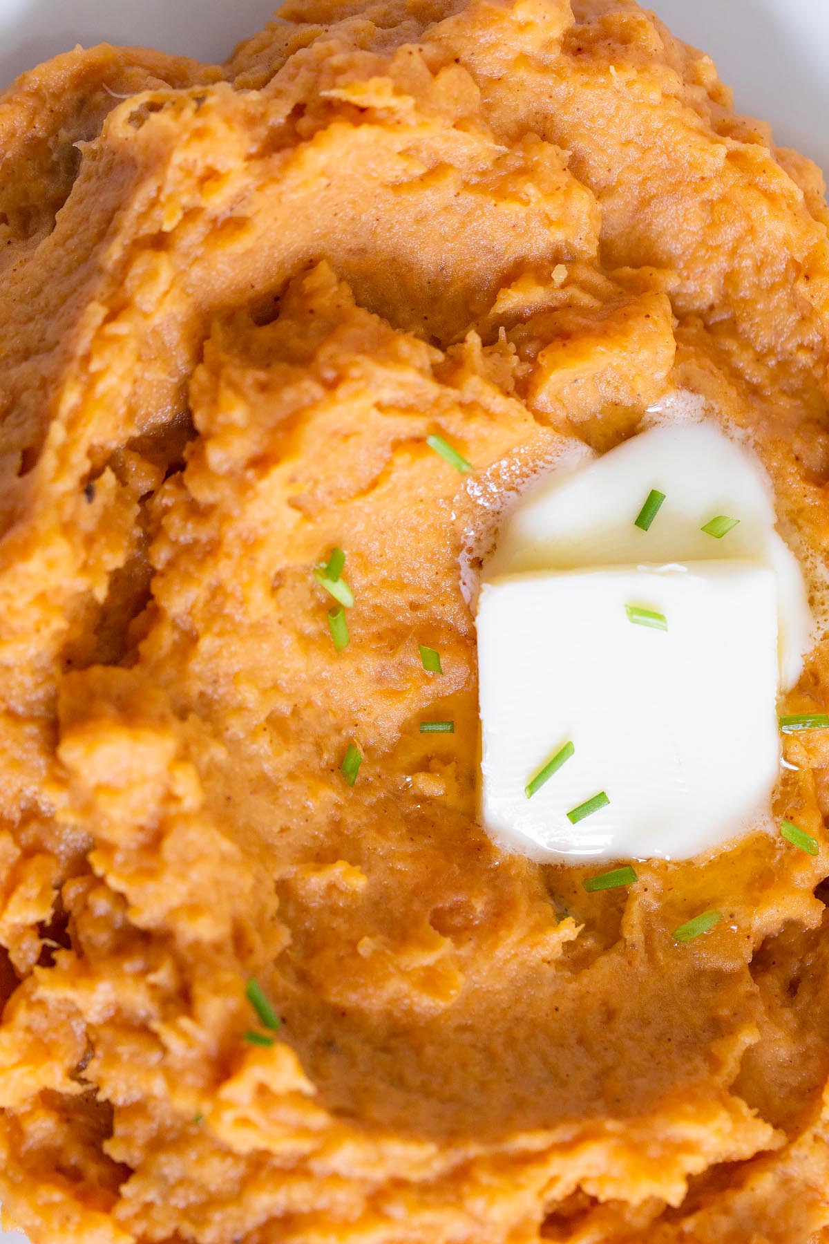 chipotle mashed sweet potatoes with butter up close