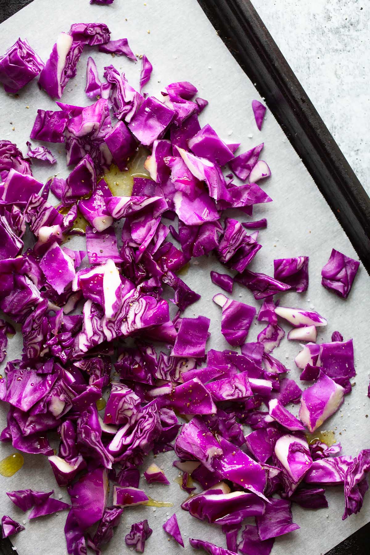 raw red cabbage on a baking sheet