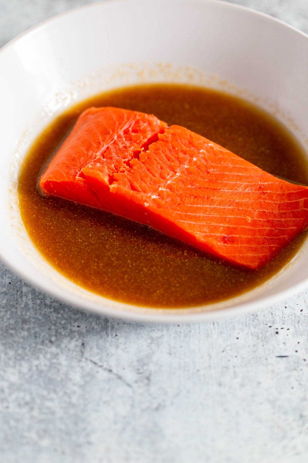 salmon marinating in sauce