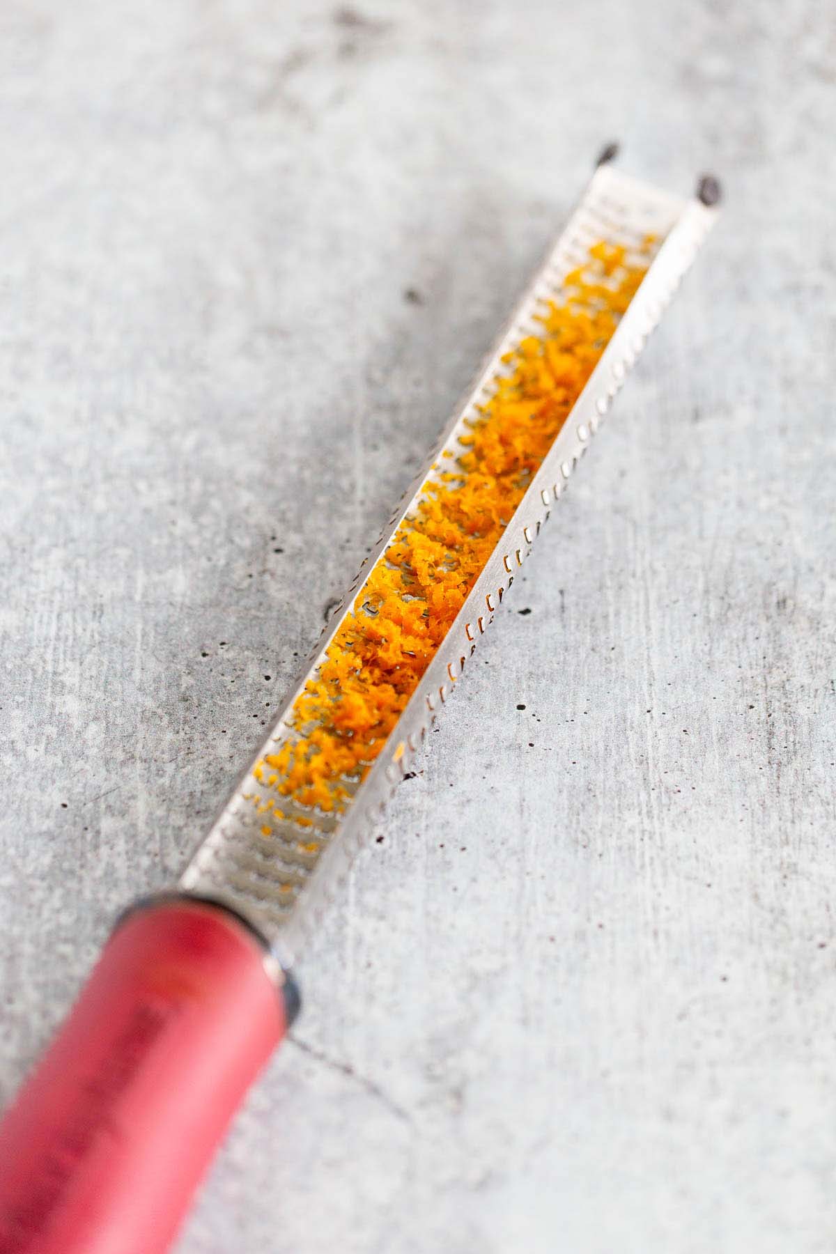 orange zest in a microplane