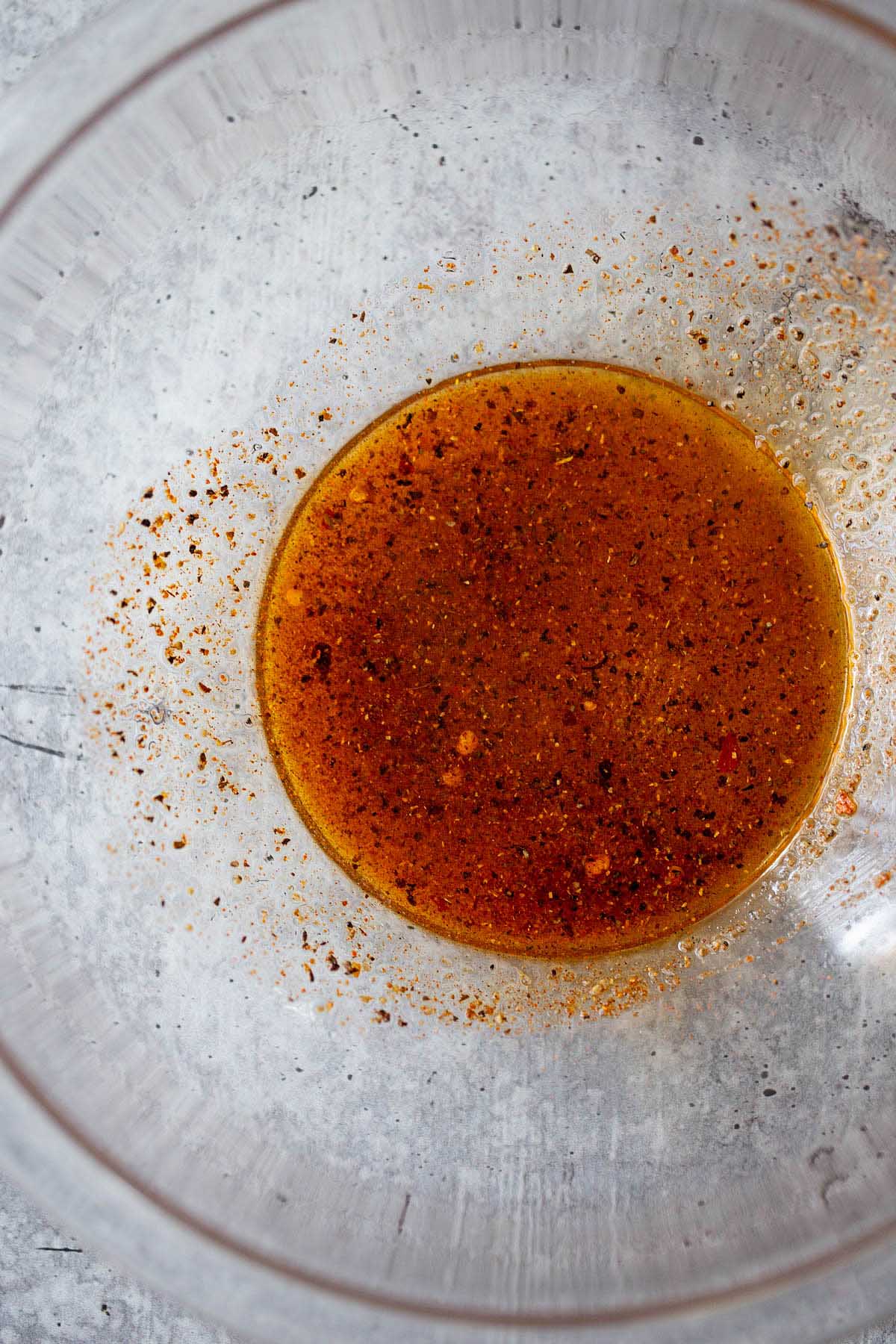 seasonings mixed together in a glass bowl.