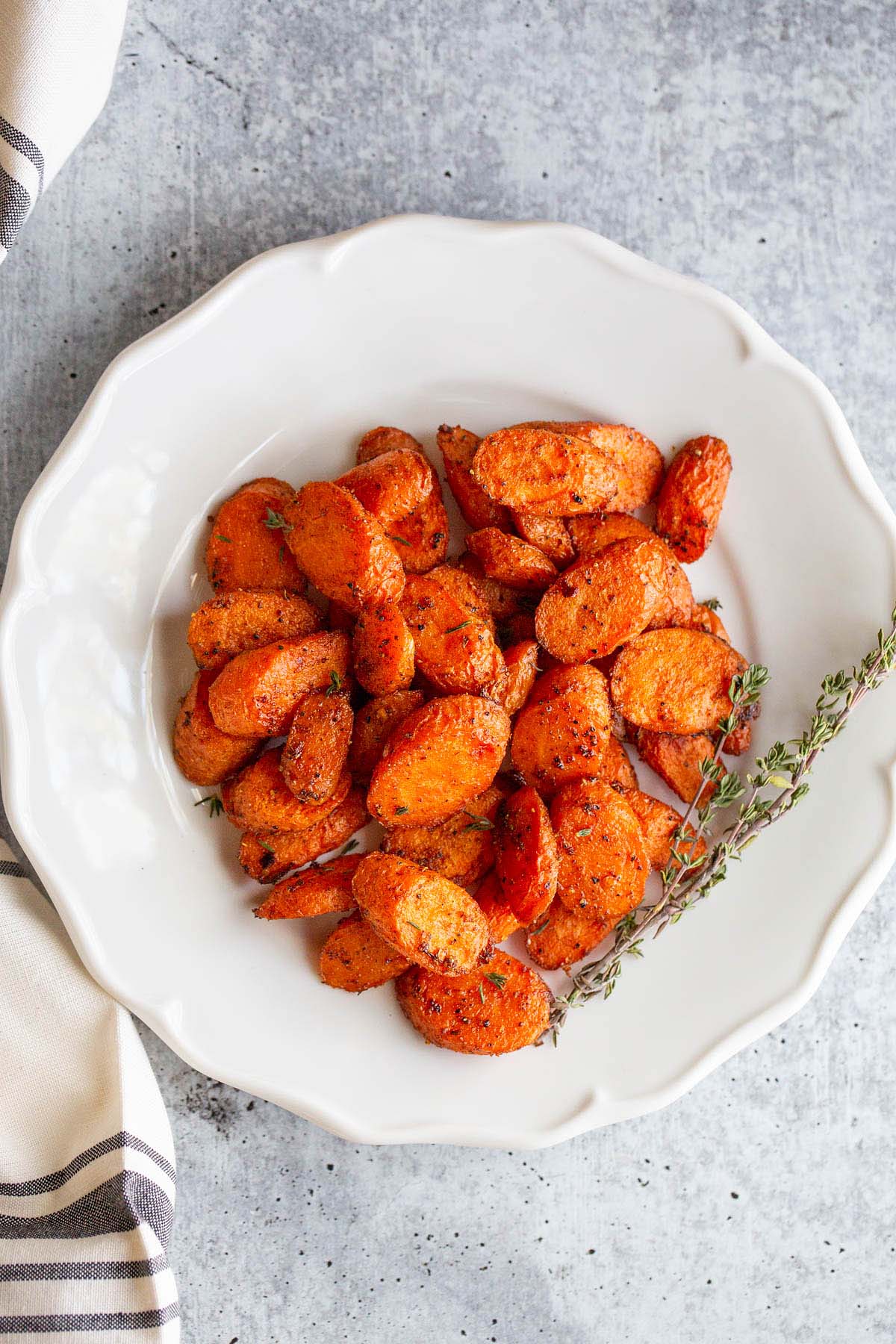 roasted carrots on a white plate.