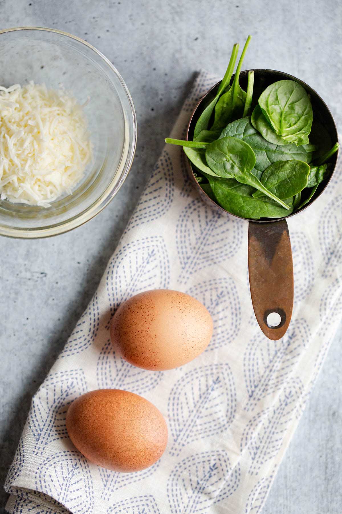 ingredients - spinach, eggs, and mozzarella cheese