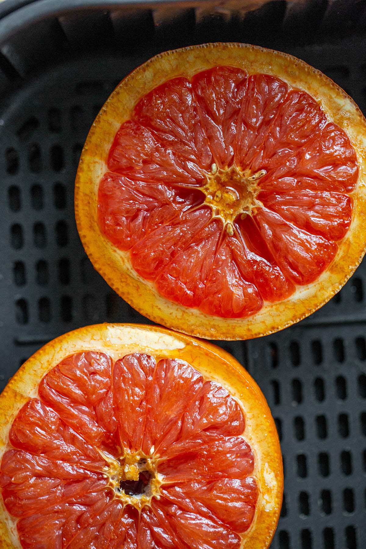 cooked grapefruit halves in air fryer basket