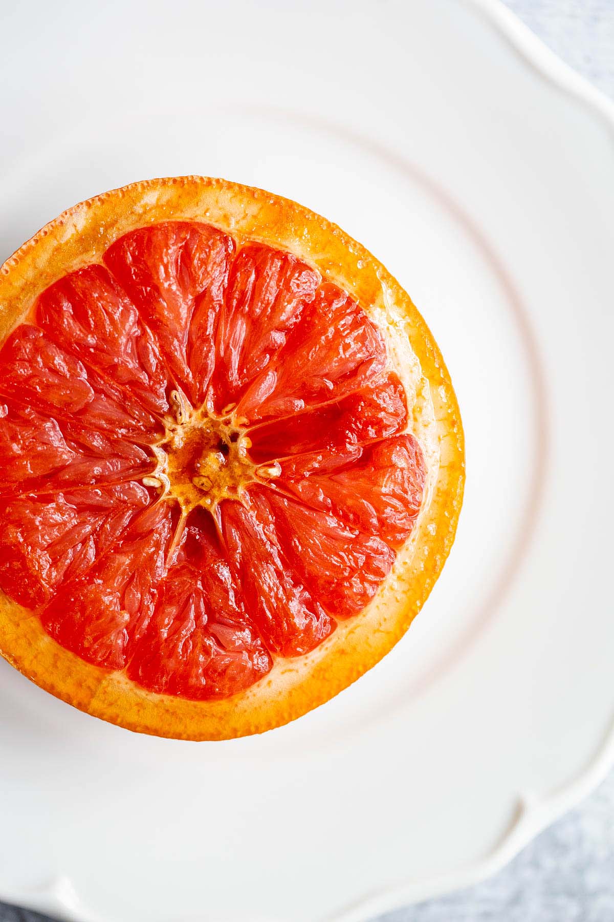 grapefruit half on a white plate