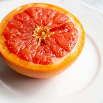 grapefruit half on a white plate