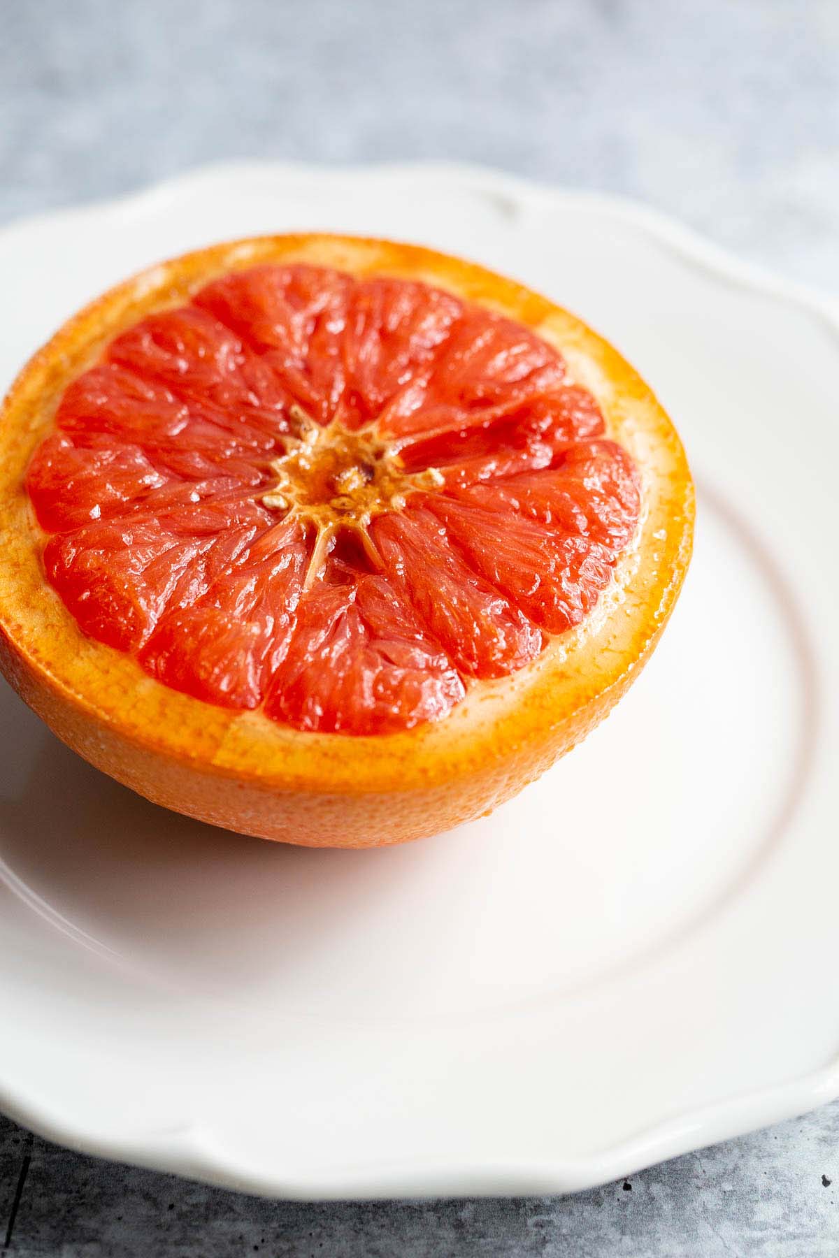 grapefruit half on a white plate