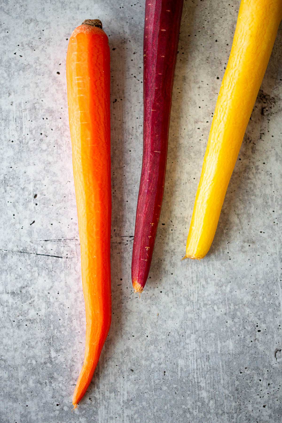 3 peeled rainbow carrots.