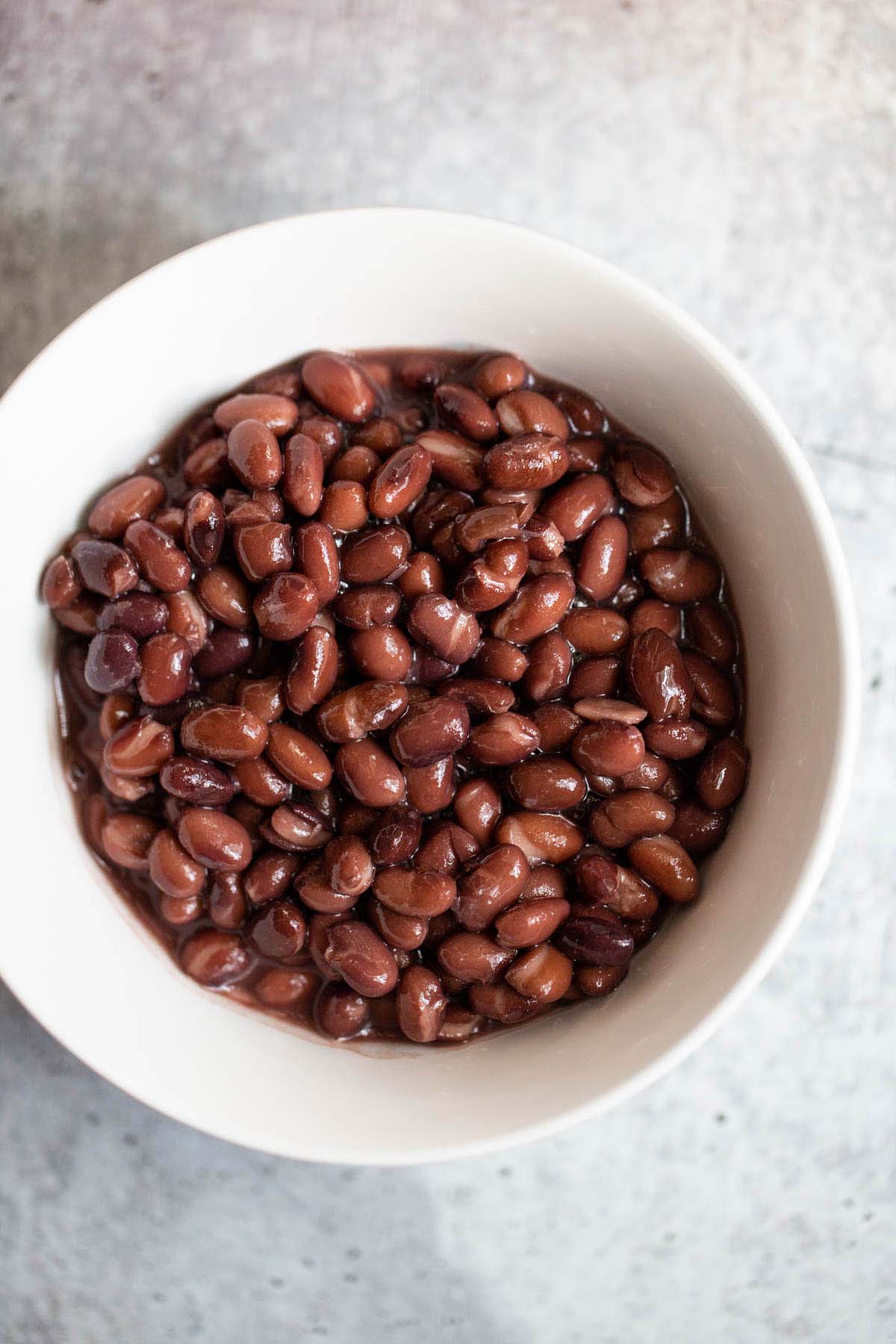 Black beans in a white bowl.