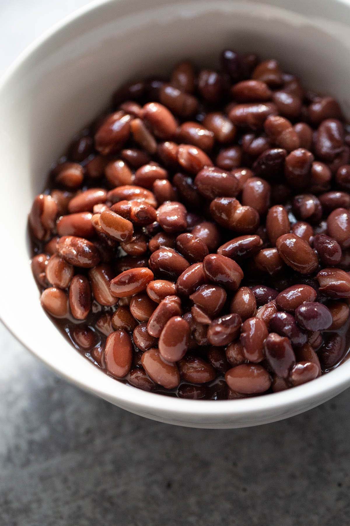 Black beans in a white bowl.