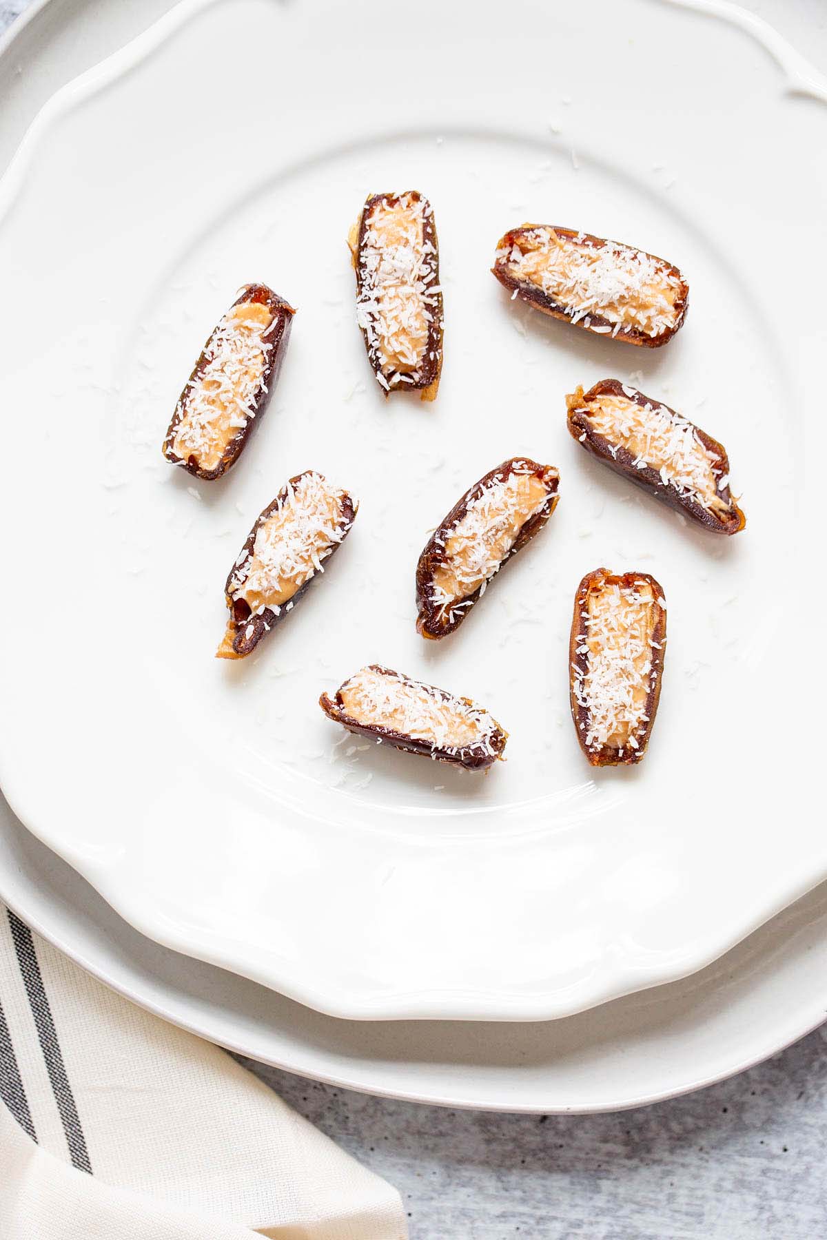 dates topped with peanut butter and coconut.