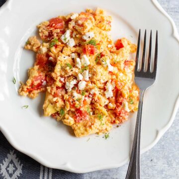 scrambled eggs with tomatoes and feta.