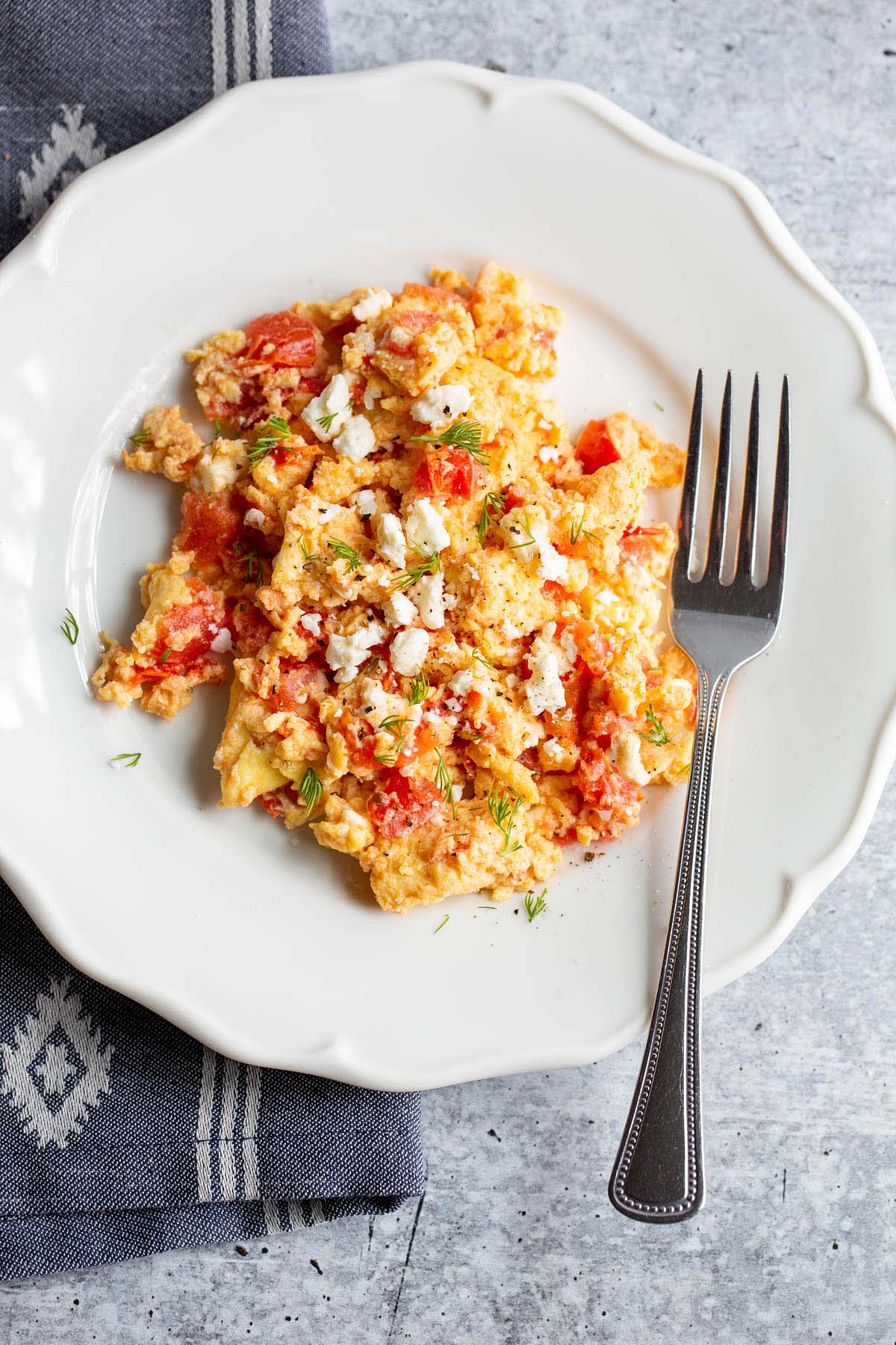 scrambled eggs with tomatoes and feta.