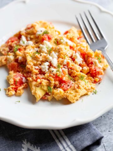 scrambled eggs with tomatoes and feta.