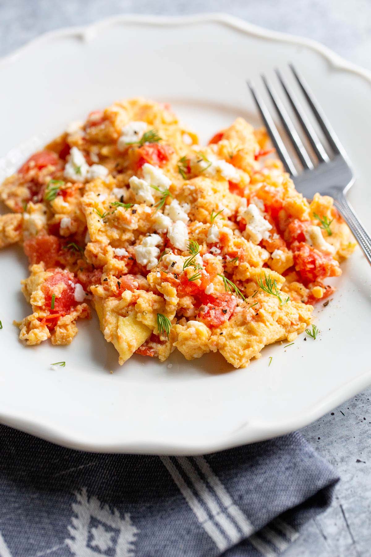 scrambled eggs with tomatoes and feta.