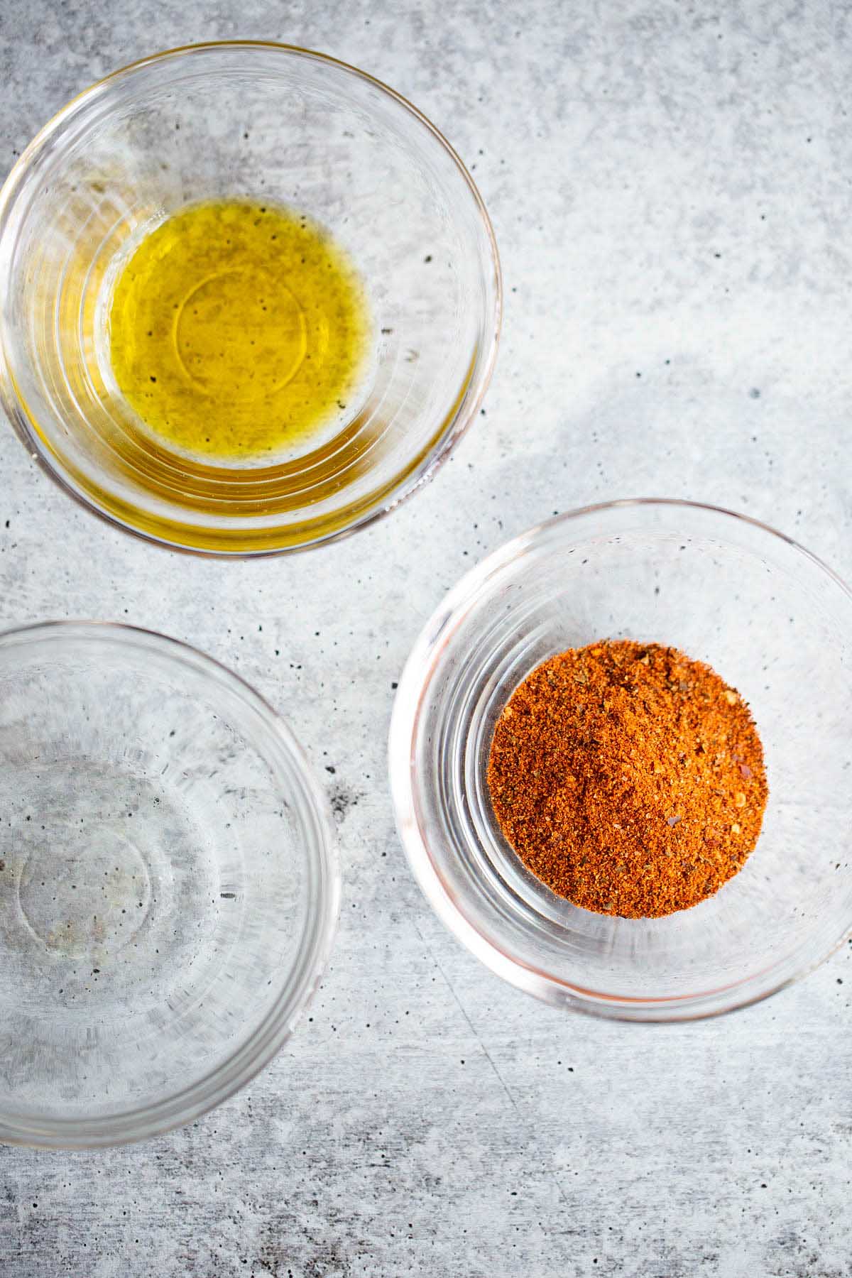 harissa spice, olive oil, and water in small bowls.