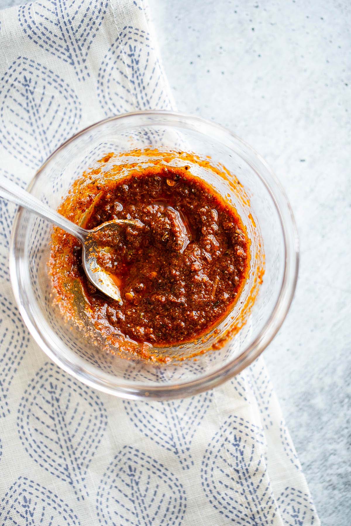 homemade harissa paste made from powder in a bowl.