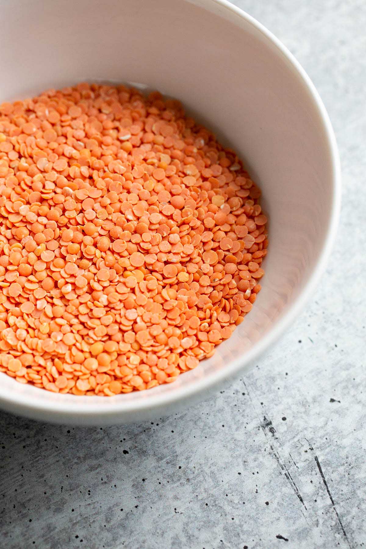 Dry red lentils in a bowl.