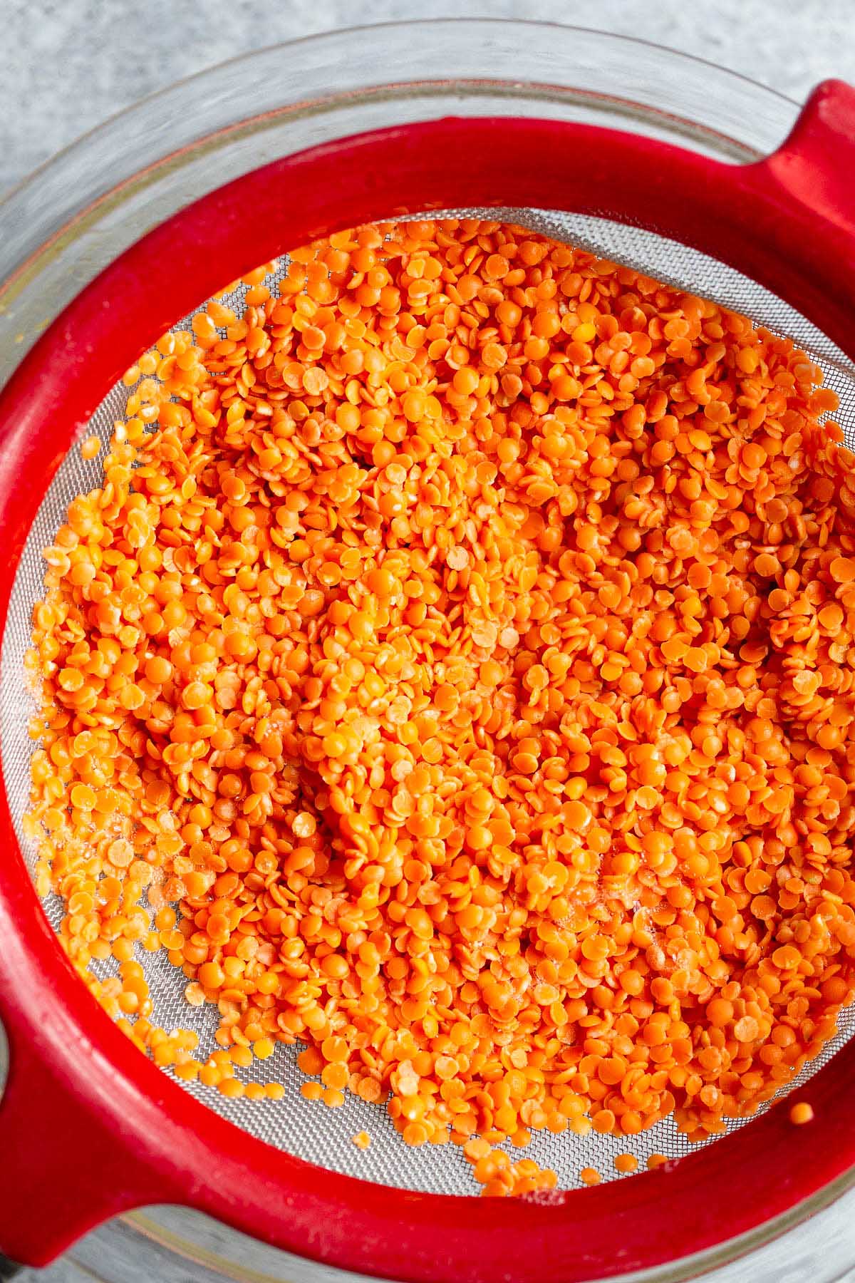 Lentils in a strainer.