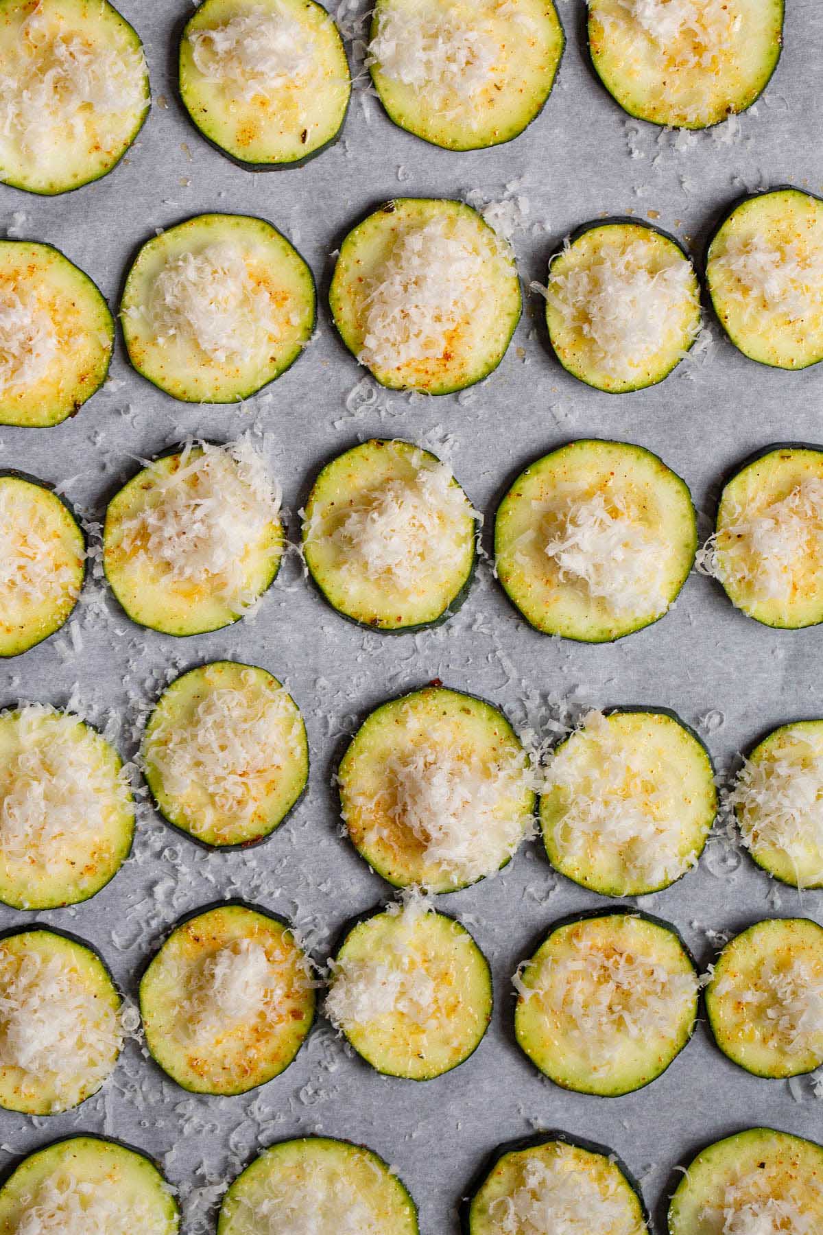 Zucchini with parmesan cheese on top.