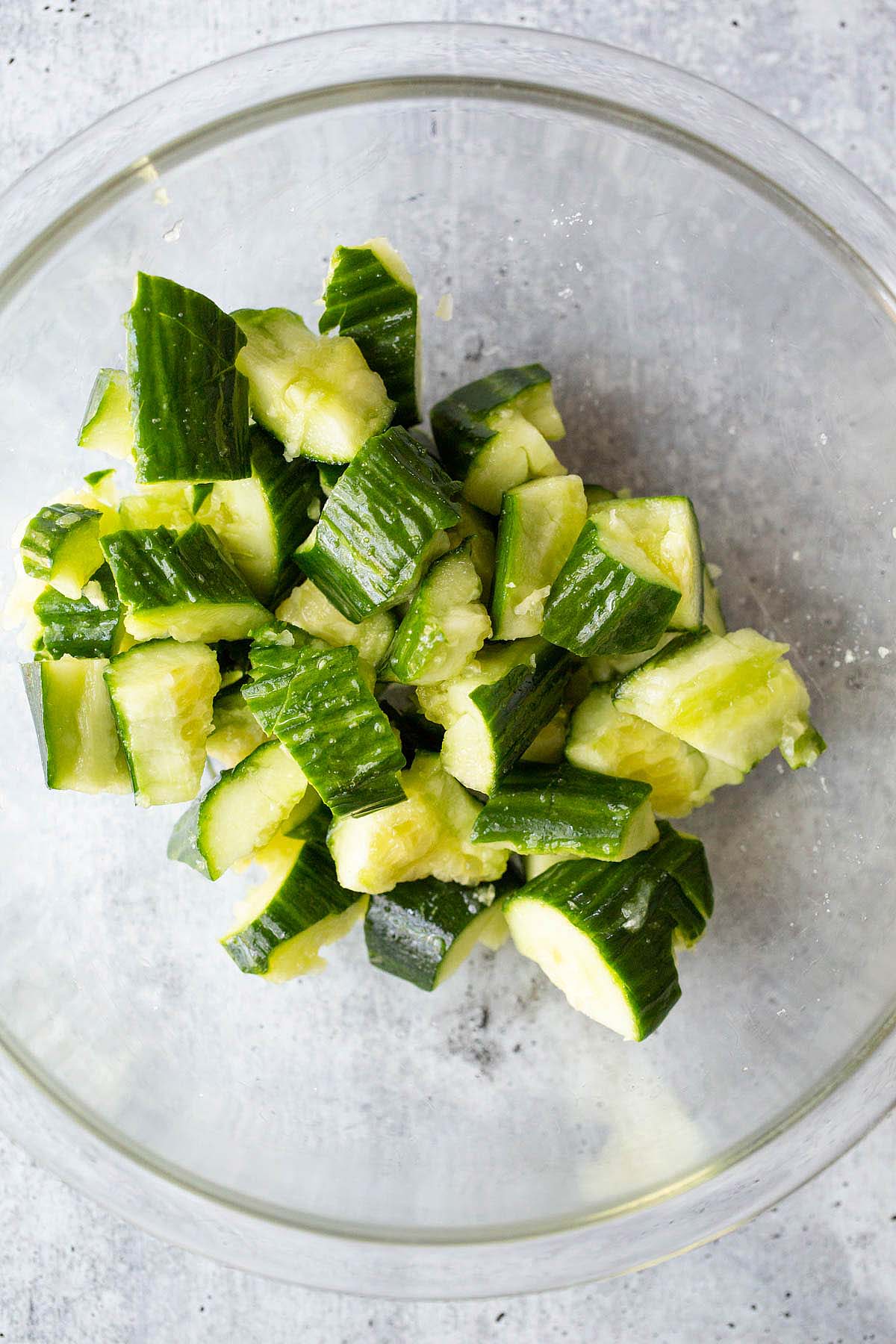 smashed cucumber in a bowl.