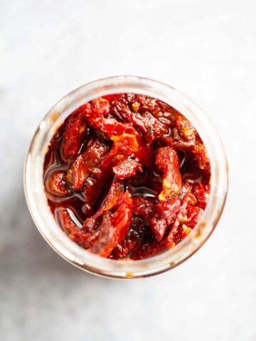 Sundried tomatoes in a jar from above.