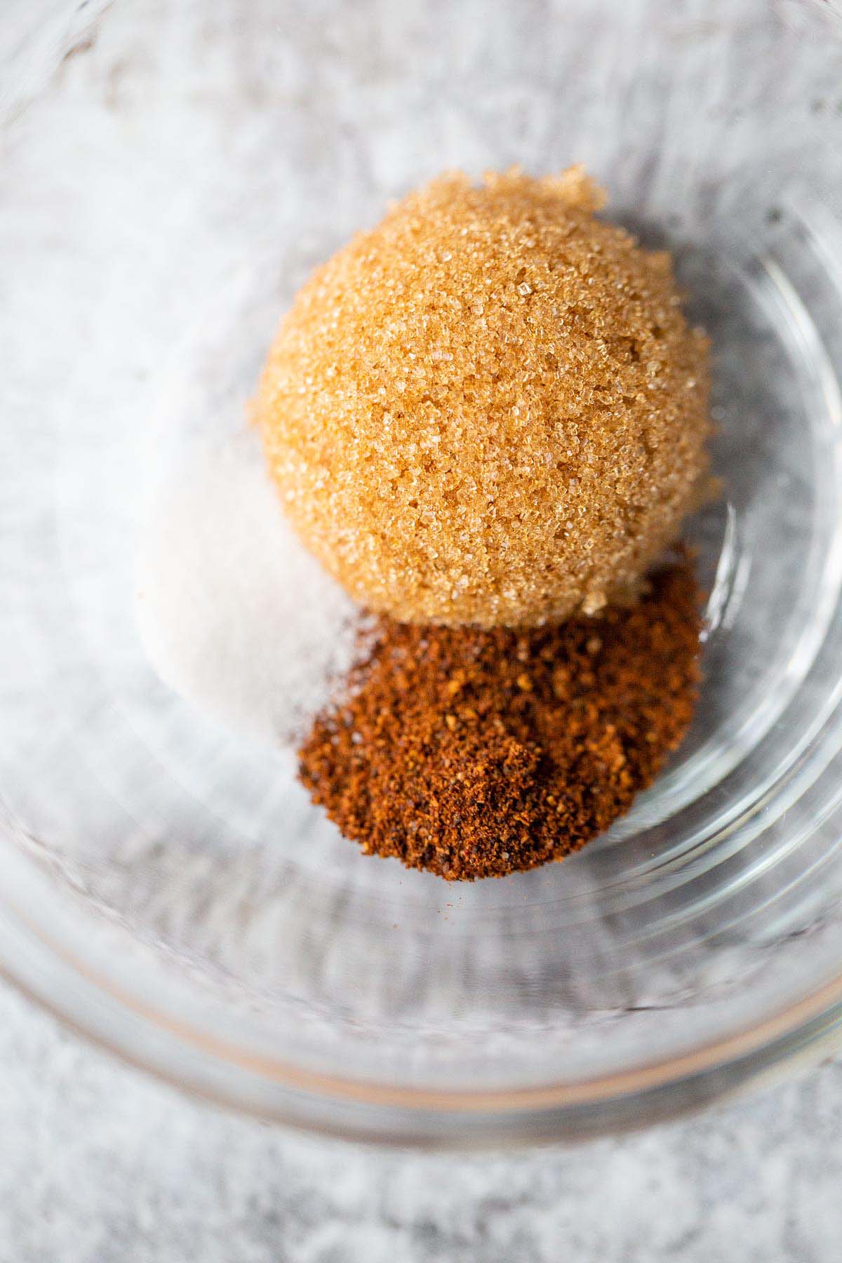 Brown sugar, chili powder, and salt in a small bowl.