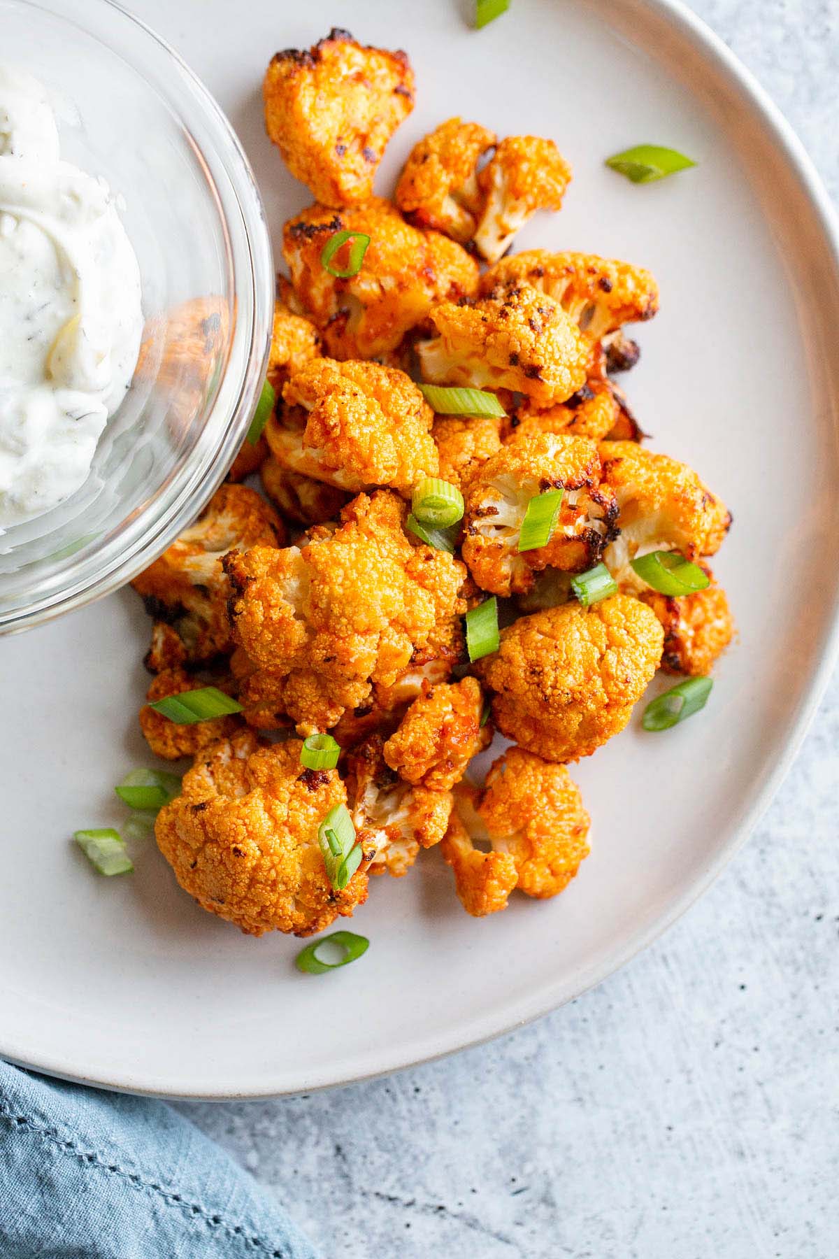 Air fryer buffalo cauliflower with green onions