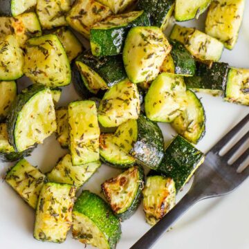 Garlic herb zucchini on a plate.