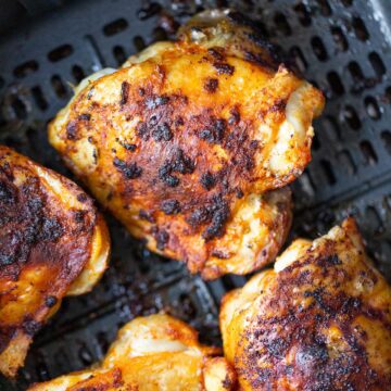 Cooked chicken thighs in the air fryer.