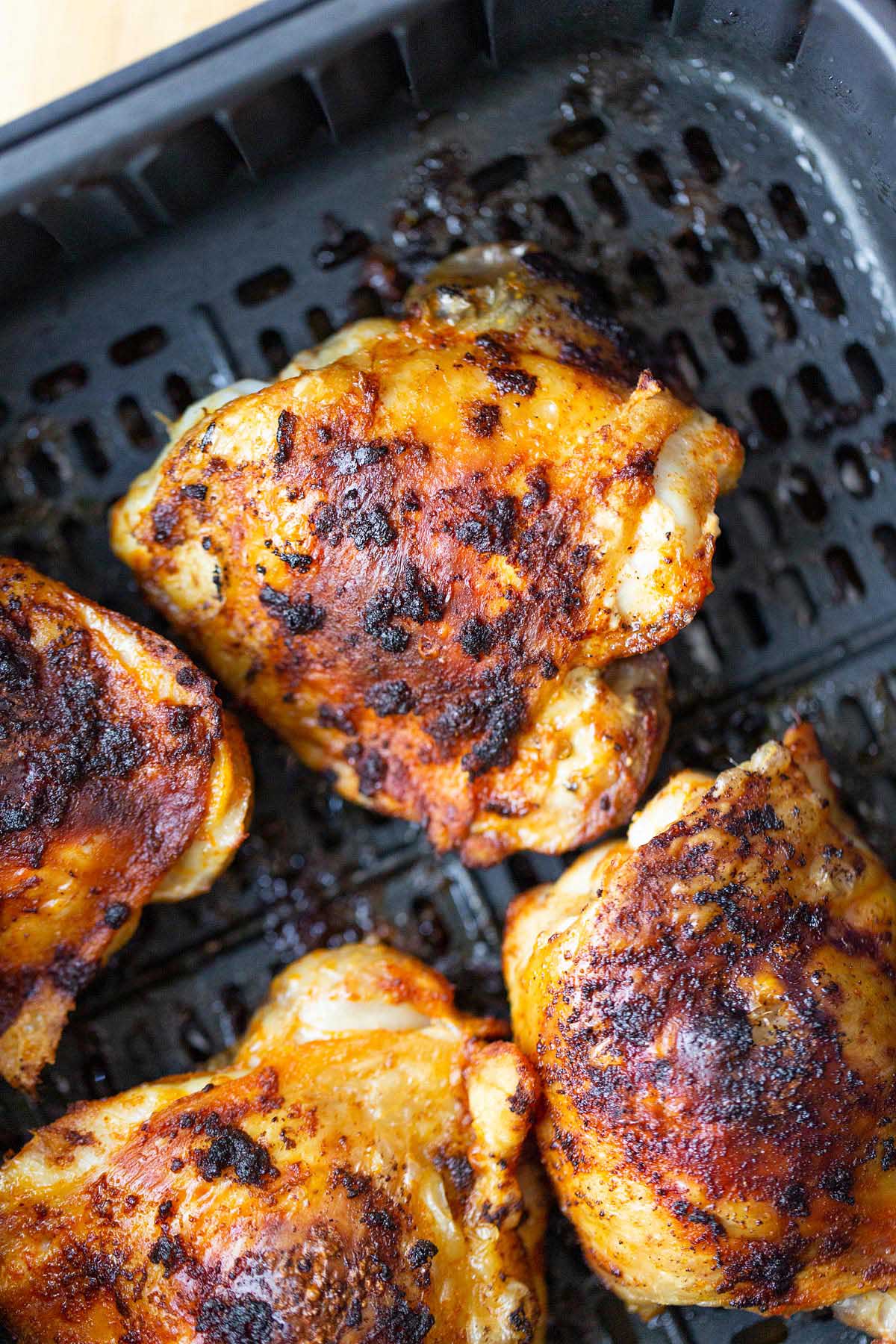 Cooked chicken thighs in the air fryer.