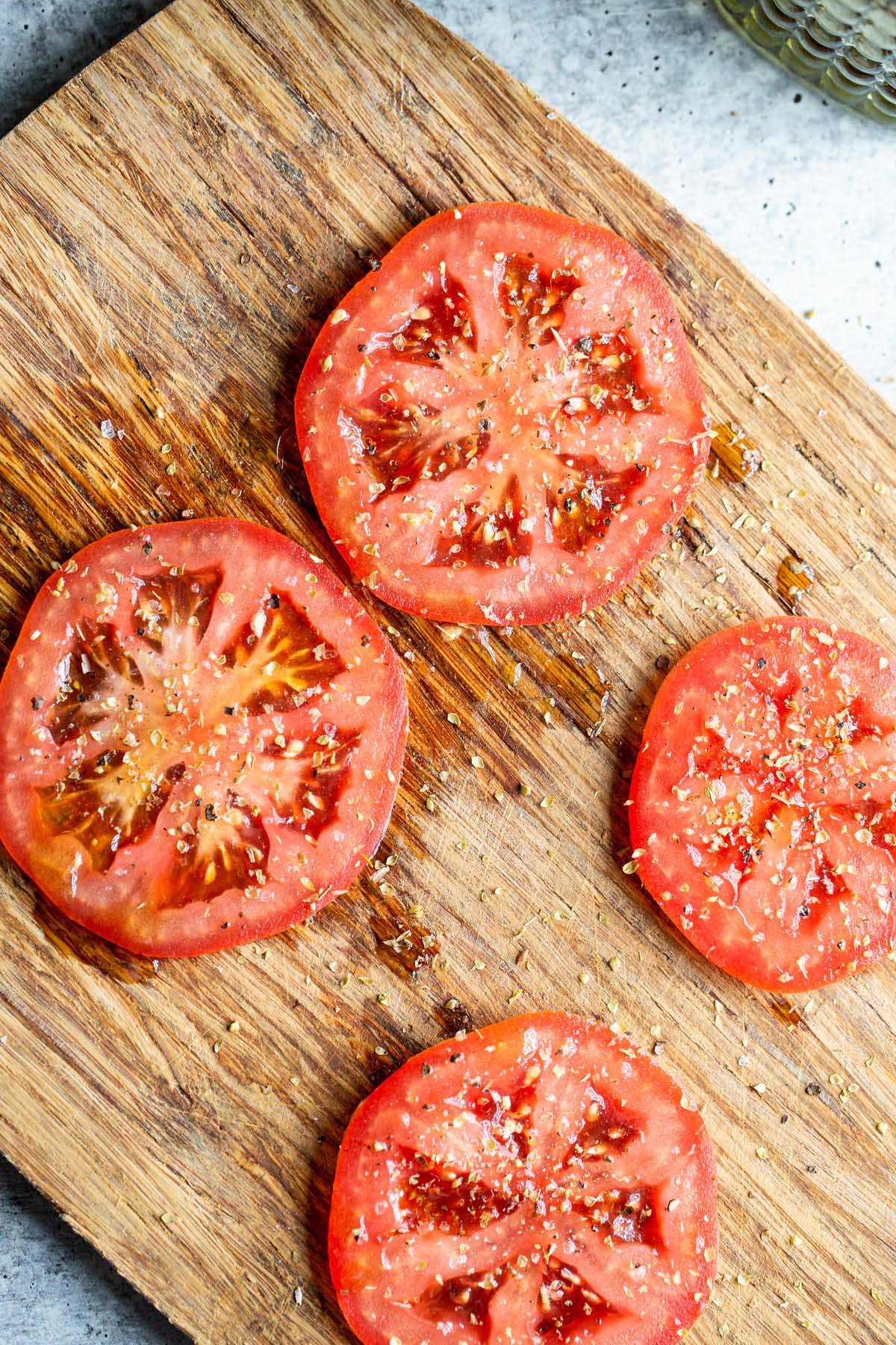 Tomato slices on a cutting board.