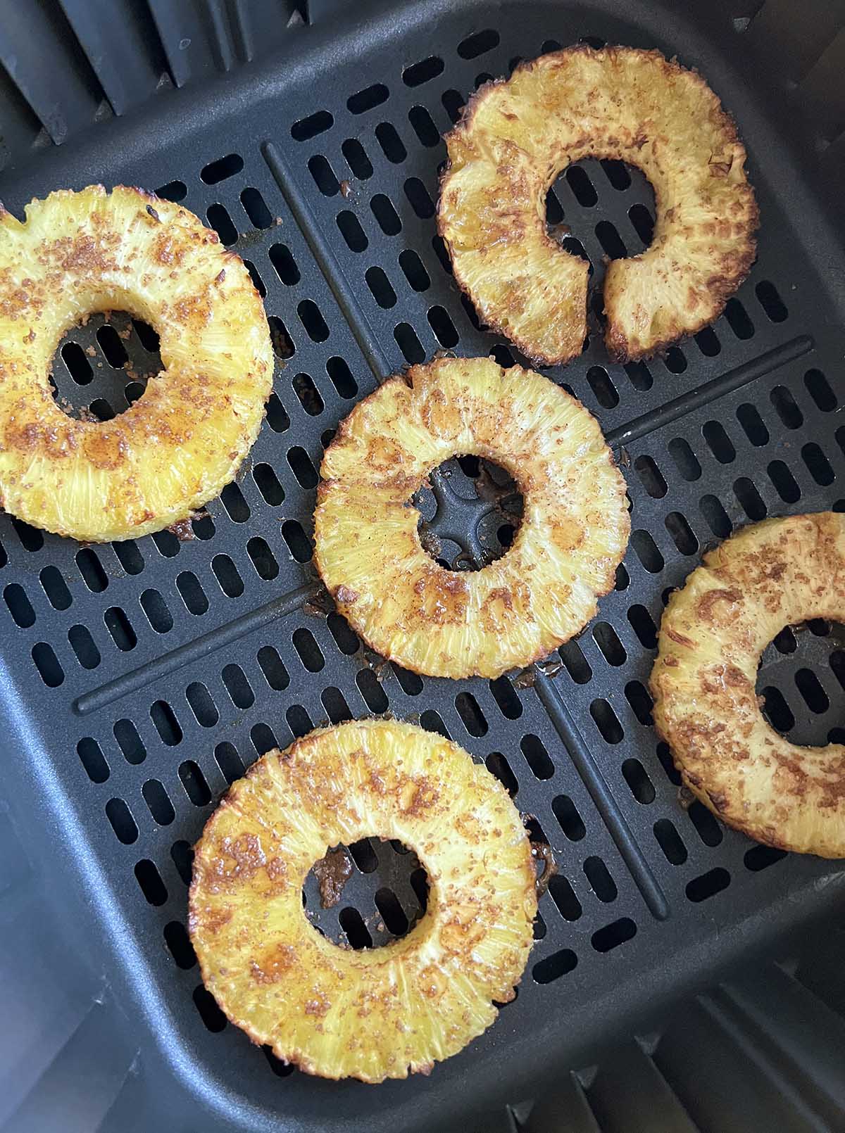 Pineapple in the air fryer basket.