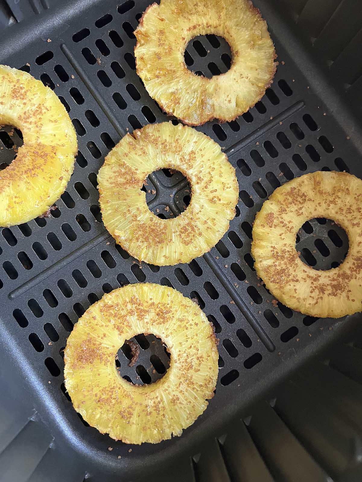 Pineapple in the air fryer basket.