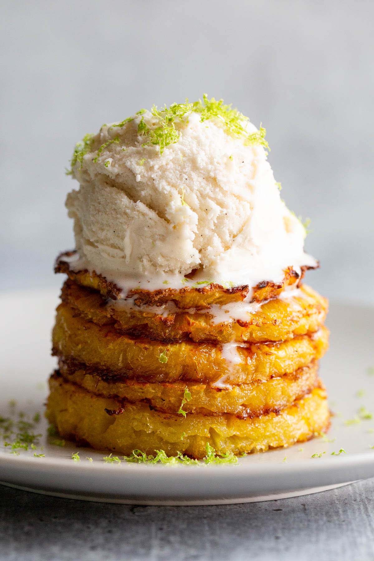 Air Fryer Pineapple with ice cream and lime zest.