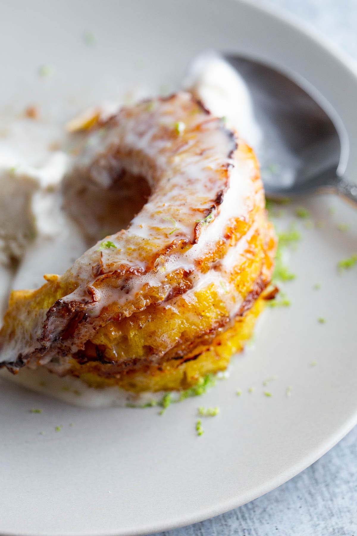 Pineapple rings with ice cream melting on top.