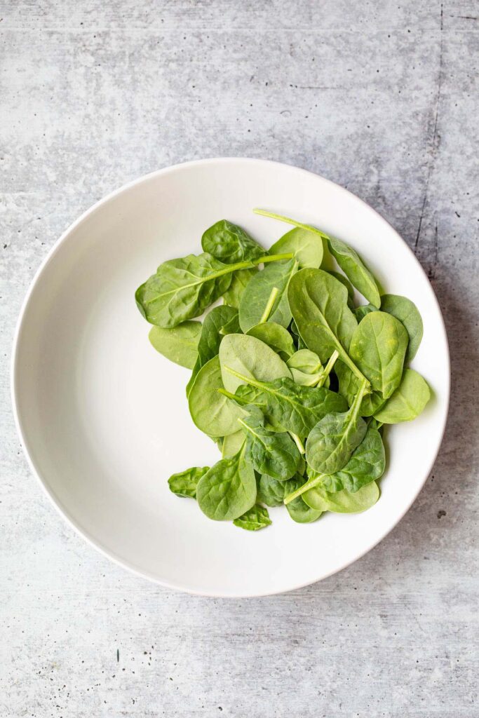 Spinach in a white bowl