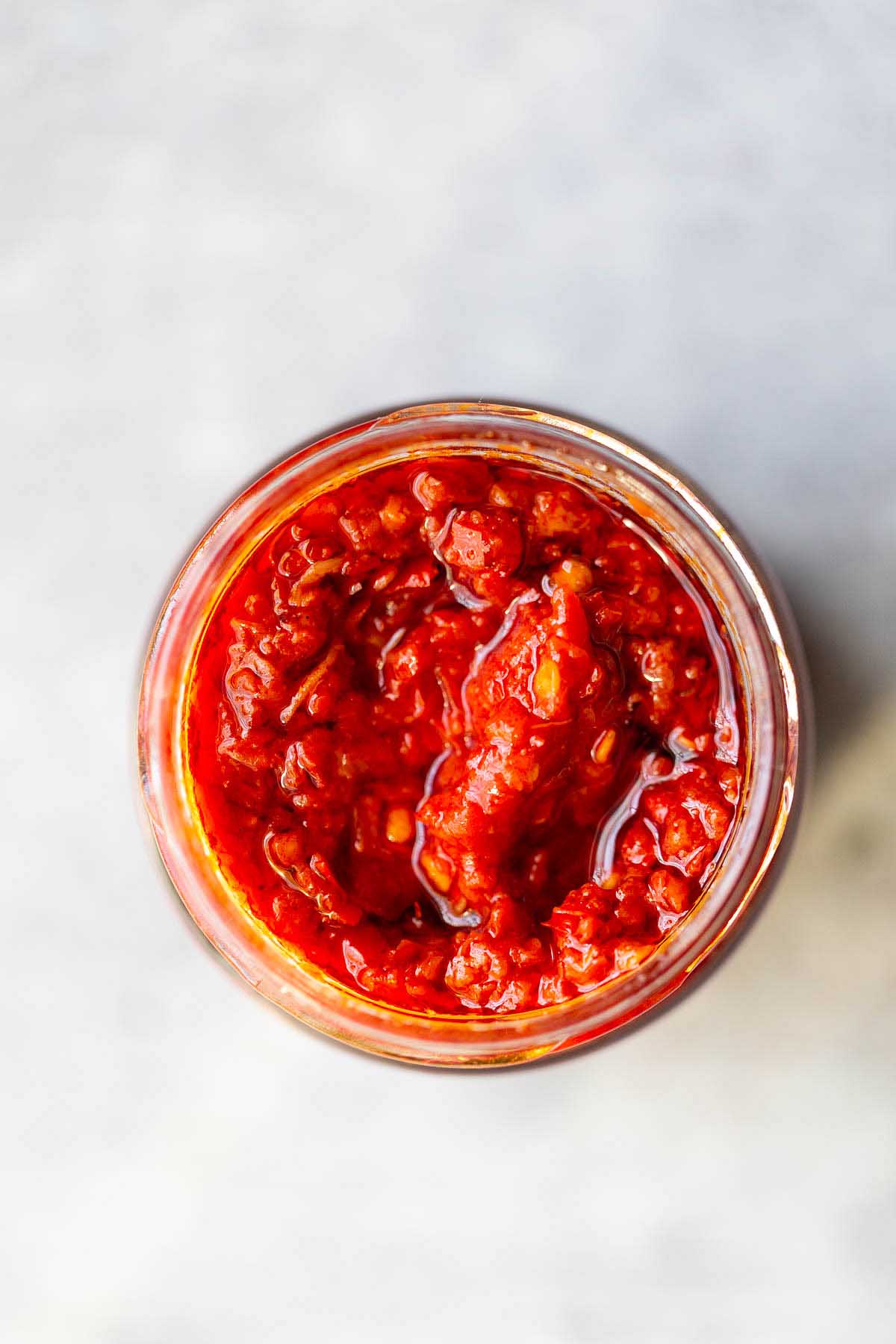 Harissa from above, jar opened.