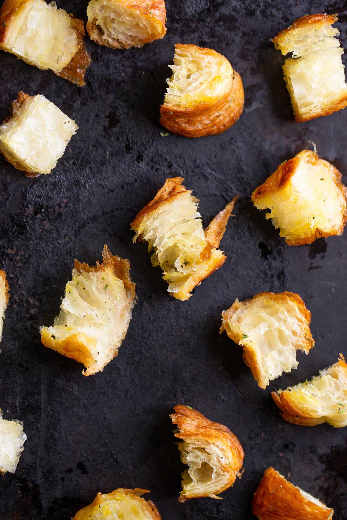 Uncooked croutons on a cookie sheet.